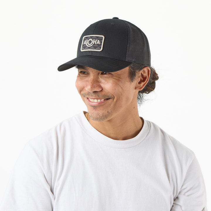 ALOHA Label Retro Trucker Hat in Black