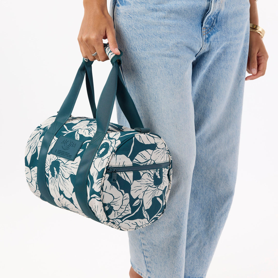 https://cdn.shopify.com/s/files/1/1119/6322/files/stubby_duffle_flor_del_mar_dark_teal_and_sandstone_cu2_op.jpg?v=1770422269