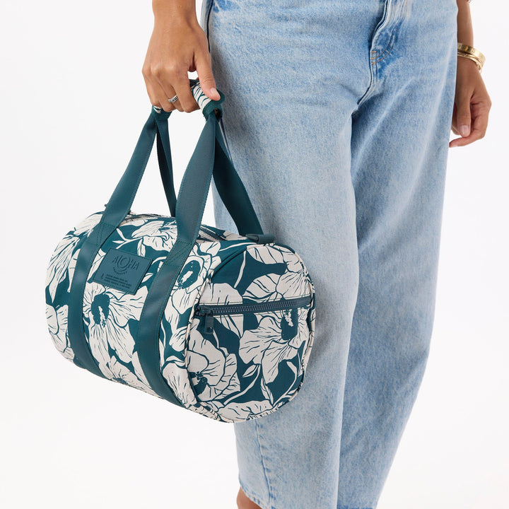 https://cdn.shopify.com/s/files/1/1119/6322/files/stubby_duffle_flor_del_mar_dark_teal_and_sandstone_cu2_op.jpg?v=1770422269