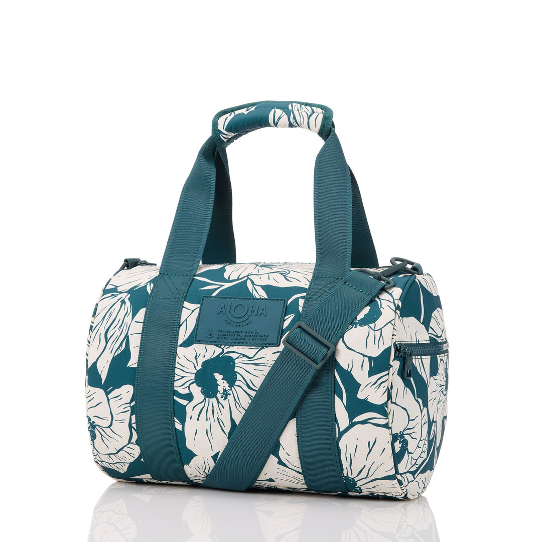 https://cdn.shopify.com/s/files/1/1119/6322/files/stubby_duffle_flor_del_mar_dark_teal_on_sandstone_1jpg_op.jpg?v=1770422269