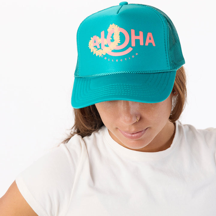 https://cdn.shopify.com/s/files/1/1119/6322/files/trucker_hat_lei_aloha_jade_cu1.jpg?v=1768506283